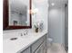 Bathroom featuring a vanity with double sinks, quartz countertop and a glass-enclosed shower at 2240 Six Branches Dr, Roswell, GA 30076