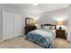 This bedroom features a comfortable bed and well-maintained wooden furniture, with light entering from the side at 2240 Six Branches Dr, Roswell, GA 30076