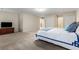 Spacious bedroom featuring neutral tones, plush carpeting, and ample closet space with an adjoining bathroom at 2240 Six Branches Dr, Roswell, GA 30076