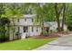 Charming two-story home with a well-manicured lawn and mature trees, offering great curb appeal at 2240 Six Branches Dr, Roswell, GA 30076