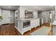Stylish kitchen island featuring seating, granite countertops, stainless steel appliances, and modern cabinetry at 2240 Six Branches Dr, Roswell, GA 30076