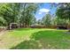 Expansive backyard featuring well-maintained lawn, gazebo, and built-in grill area at 3131 Sumter Ct, Marietta, GA 30062