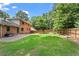 Spacious backyard with lush lawn, patio, and wooden fence offering privacy at 3131 Sumter Ct, Marietta, GA 30062
