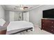 Bedroom with a ceiling fan, neutral walls, and dark wood dresser at 3131 Sumter Ct, Marietta, GA 30062