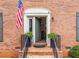 Close-up of a brick home's entrance, highlighting a welcoming door and manicured landscaping at 3131 Sumter Ct, Marietta, GA 30062