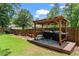 Backyard covered grilling station featuring a grill, cooler and countertop at 3131 Sumter Ct, Marietta, GA 30062