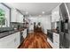 Spacious kitchen boasts modern appliances, wood floors and a view into the dining room at 3131 Sumter Ct, Marietta, GA 30062