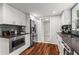 Modern kitchen with stainless steel appliances, white cabinetry, and hardwood floors at 3131 Sumter Ct, Marietta, GA 30062