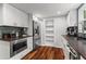 Modern kitchen with white cabinets, stainless steel appliances, and stylish backsplash at 3131 Sumter Ct, Marietta, GA 30062