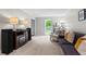 Bright living room featuring comfortable seating, neutral carpet, and natural light at 3131 Sumter Ct, Marietta, GA 30062