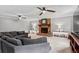 Spacious living room featuring a brick fireplace, ceiling fans, and neutral-toned decor at 3131 Sumter Ct, Marietta, GA 30062