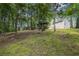 Grassy backyard with mature trees surrounding the home. Plenty of privacy and room at 4782 Donnegal Se Ct, Mableton, GA 30126