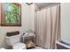 Bright bathroom featuring neutral tones, a window view, and ample storage space at 4782 Donnegal Se Ct, Mableton, GA 30126