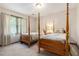 Charming bedroom featuring two beds, soft carpet, and natural light from a large window at 4782 Donnegal Se Ct, Mableton, GA 30126