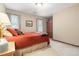 Cozy bedroom features a comfortable bed, soft carpet, and a wooden armoire at 4782 Donnegal Se Ct, Mableton, GA 30126