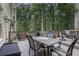 Spacious wooden deck is perfect for outdoor dining and entertaining with wooded views at 4782 Donnegal Se Ct, Mableton, GA 30126
