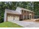 Beautiful brick home featuring a two-car garage and a well-maintained front yard at 4782 Donnegal Se Ct, Mableton, GA 30126