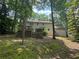Back exterior view of the home with an expansive yard and a multi-tiered deck at 4782 Donnegal Se Ct, Mableton, GA 30126
