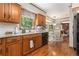 Bright kitchen showcasing granite counters, stainless steel appliances, wooden floors, and eat-in breakfast area at 4782 Donnegal Se Ct, Mableton, GA 30126