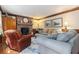 Cozy living room with a brick fireplace, comfortable seating, and natural light at 4782 Donnegal Se Ct, Mableton, GA 30126