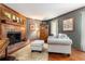 Classic living room featuring a fireplace, hardwood floors, elegant decor, and gray walls with wood trim at 4782 Donnegal Se Ct, Mableton, GA 30126