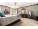 Serene bedroom with a king bed, ceiling fan, soft carpeting, and warm, inviting decor at 4782 Donnegal Se Ct, Mableton, GA 30126