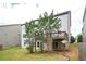 Backyard with a wooden deck and mature trees providing shade and privacy at 558 Olympic Way, Acworth, GA 30102
