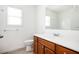 Bathroom featuring a single sink vanity, toilet and a window at 558 Olympic Way, Acworth, GA 30102