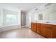 Bright bathroom featuring a double sink vanity, soaking tub and glass-enclosed shower at 558 Olympic Way, Acworth, GA 30102