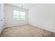 Neutral bedroom with carpet, window and standard door at 558 Olympic Way, Acworth, GA 30102