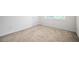 Neutral bedroom with carpet, window, door and electrical outlets at 558 Olympic Way, Acworth, GA 30102