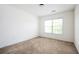 Neutral bedroom features carpet, a large window and a ceiling light at 558 Olympic Way, Acworth, GA 30102
