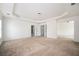 Large primary bedroom with trey ceilings, carpet, and ensuite bathroom at 558 Olympic Way, Acworth, GA 30102