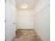 Walk-in closet with shelving and door, offering ample storage space at 558 Olympic Way, Acworth, GA 30102
