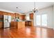 Beautiful kitchen with stainless steel appliances, center island, and adjacent dining area with patio access at 558 Olympic Way, Acworth, GA 30102