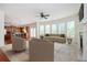 Open-concept living space with sofa, fireplace, and breakfast area, great for modern living at 558 Olympic Way, Acworth, GA 30102