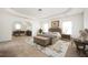 Spacious primary suite with a sitting area and a tray ceiling offers a luxurious retreat at 558 Olympic Way, Acworth, GA 30102