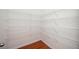 Spacious walk-in closet with white wire shelving and hardwood floors at 558 Olympic Way, Acworth, GA 30102