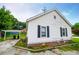 The backyard includes a carport over a gravel area and a well-maintained lawn at 8573 Campbellton St, Douglasville, GA 30134
