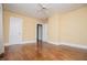 Spacious bedroom featuring hardwood floors, neutral walls, and ample closet space at 8573 Campbellton St, Douglasville, GA 30134
