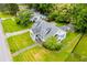 Aerial view of a charming home with mature trees and a well-manicured lawn at 8573 Campbellton St, Douglasville, GA 30134