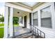 Inviting front porch with classic white columns and traditional railing detail at 8573 Campbellton St, Douglasville, GA 30134