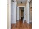 Hallway view showing hardwood floors and multiple white doors at 8573 Campbellton St, Douglasville, GA 30134