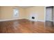 Spacious living room boasts hardwood floors, fireplace, and natural light at 8573 Campbellton St, Douglasville, GA 30134