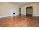 Open living room featuring hardwood floors and a decorative fireplace at 8573 Campbellton St, Douglasville, GA 30134