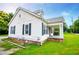 Home with well-kept side yard showing the landscaping and classic design with dark shutters at 8573 Campbellton St, Douglasville, GA 30134