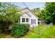 This home features a partially fenced yard with mature trees adding shade and privacy to the property at 8573 Campbellton St, Douglasville, GA 30134