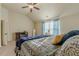Comfortable bedroom featuring carpeted floors, neutral walls, and a ceiling fan at 879 Tranquil Way, Hampton, GA 30228