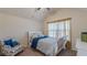 Bright bedroom featuring vaulted ceilings, carpet, and a comfortable bed creates a cozy retreat at 879 Tranquil Way, Hampton, GA 30228