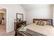 Bedroom with natural light, carpet, and wood furniture creates a relaxing atmosphere at 879 Tranquil Way, Hampton, GA 30228